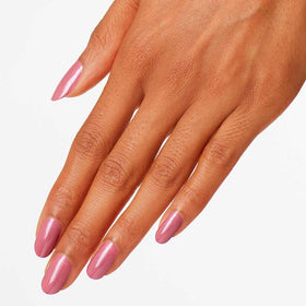 OPI painted nails on hand displaying wearable sheer pink and polished look