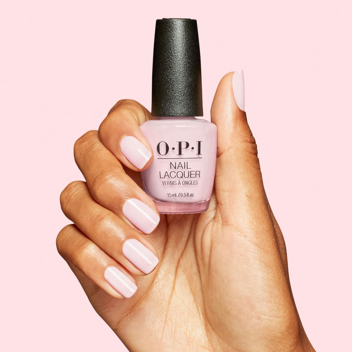 OPI polish next to coin for size and scale comparison