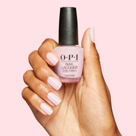 OPI polish next to coin for size and scale comparison