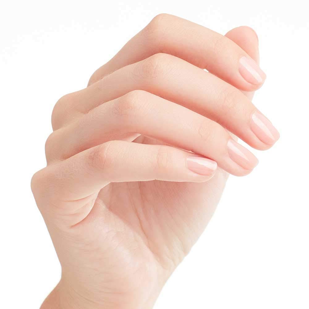OPI hand swatch wearing Passion showing natural soft pink and flattering effect