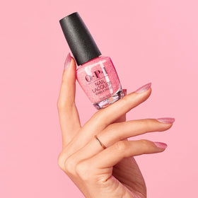 Hand wearing Pixel Dust on nails in natural light showing pearlescent shine and wearable style