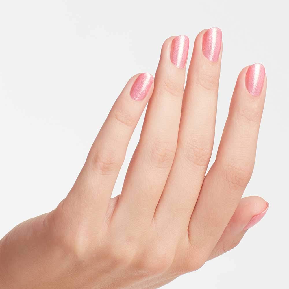 OPI painted nails on model hand showing wearable sparkle and chip resistance