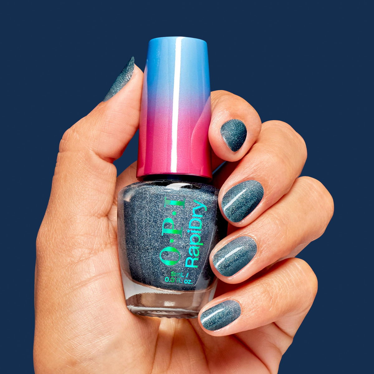 OPI nail application in hand demonstrating smooth spread and fast coverage benefit