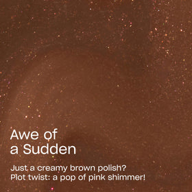 OPI swatch on skin exhibiting opaque brown with pink shimmer depth benefit