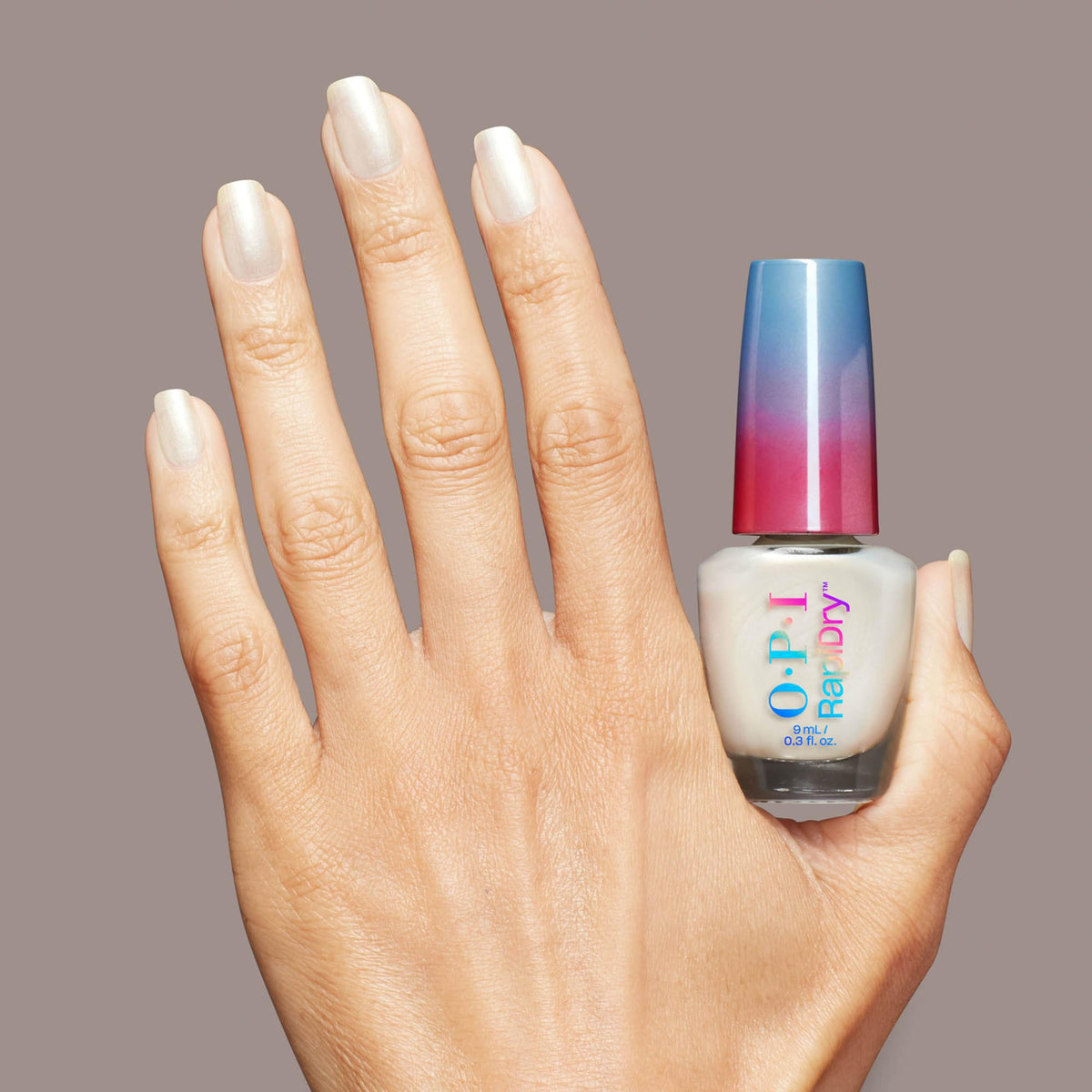 OPI bottle held in hand for scale, compact size and easy storage