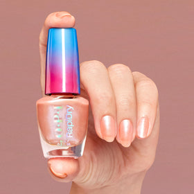 OPI painted nails in everyday setting showing glossy peach shimmer and neat wear