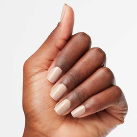 OPI application close-up of brush applying polish delivering salon-quality results