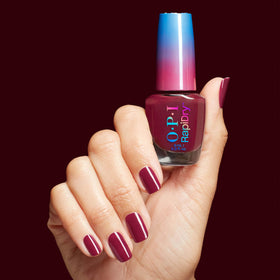OPI mani styled in holiday setting showing deep berry color and festive-ready benefit