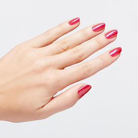 OPI on a hand model showing Strawberry Margarita manicure for polished, glossy results
