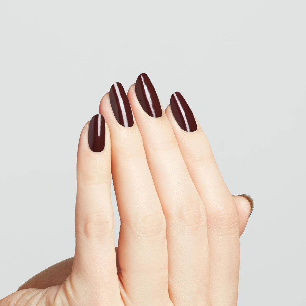 OPI swatch on nail tip demonstrating opaque coverage and true color payoff