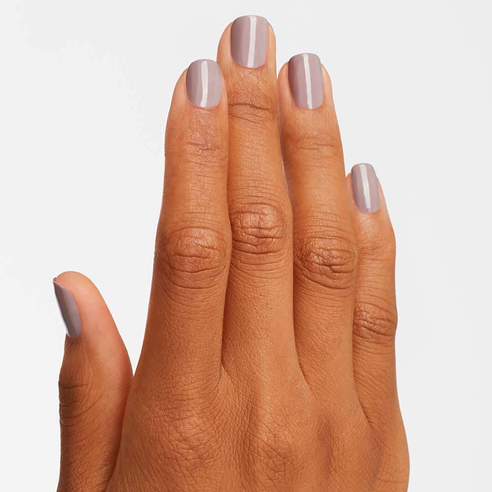OPI on-nail swatch on hand showing opaque coverage and wearable neutral benefit