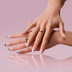 Hand applying OPI Tin Man Can Glaze with applicator showing simple at-home use