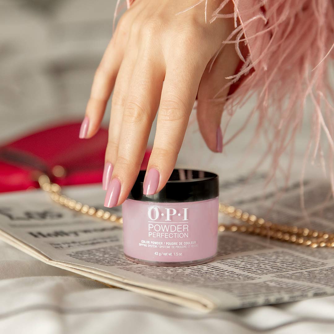 OPI top coat being applied to fingers for quick-dry, salon finish
