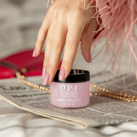 OPI top coat being applied to fingers for quick-dry, salon finish