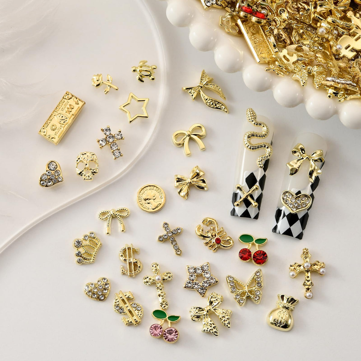 OPMADM detailed view of butterfly and bow charms showing delicate shapes for elegant nails