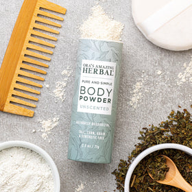 Ora's Amazing Herbal tube beside hand illustrating compact travel size