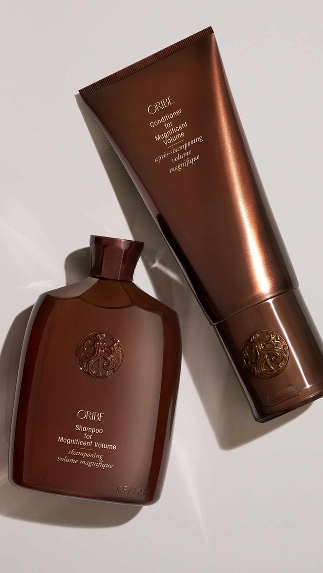 Oribe apply to towel‑dried hair demonstration showing improved combing