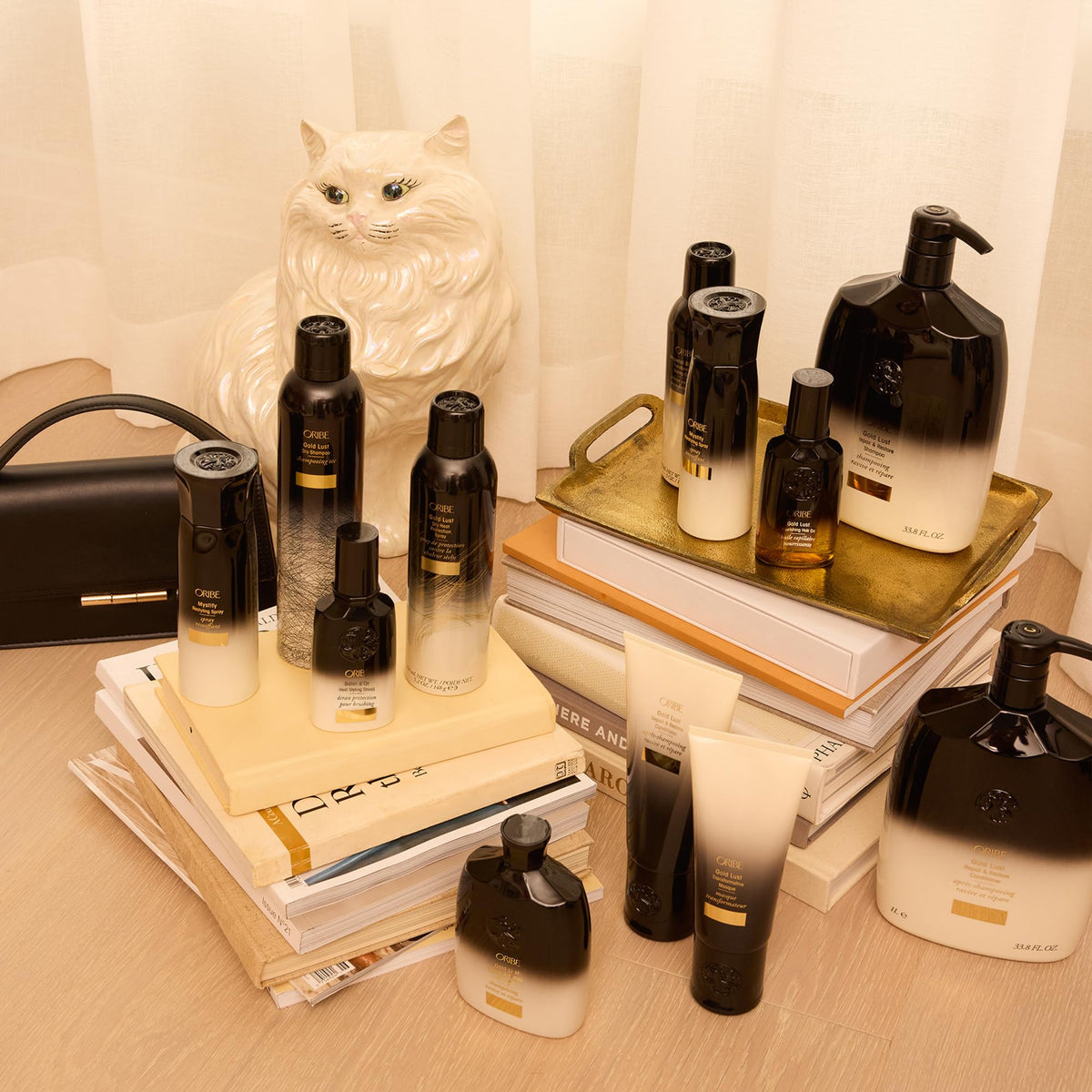 Oribe Balm D'Or finished styled hair in lifestyle setting showing shine and polished texture