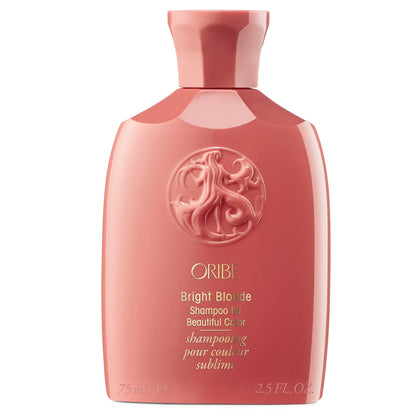 Oribe travel bottle front packaging shows brightening shampoo and portable benefit