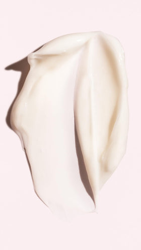 ORIBE conditioner being applied to hair in hand for easy distribution