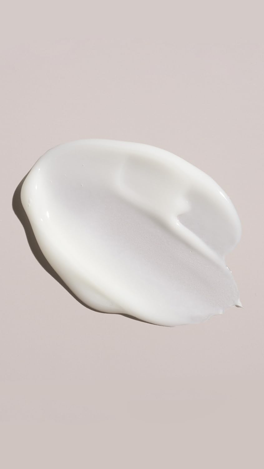 Oribe conditioner in hand size comparison highlighting travel friendly size