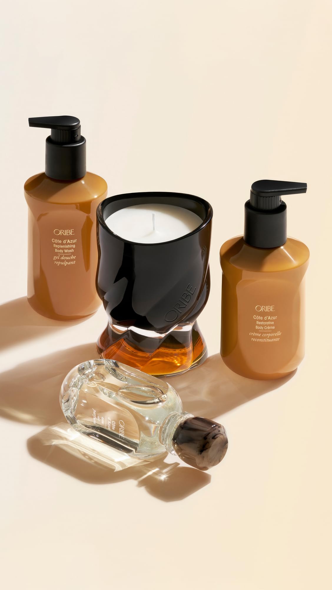 ORIBE bottle in shower lifestyle scene showing luxurious routine and lingering Côte d’Azur scent benefit