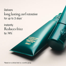 Cream dispensed on palm demonstrating Oribe lightweight spreadability and touchable hold