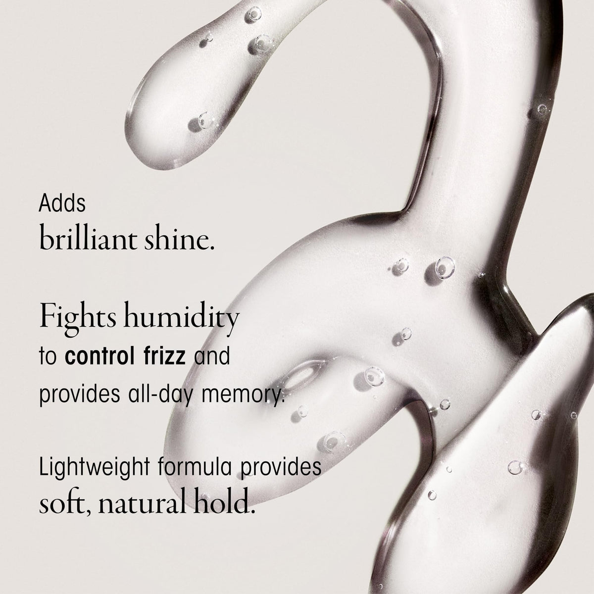 Oribe Curl Gloss gel texture on hand showing lightweight consistency and shine