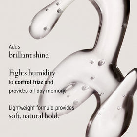 Oribe Curl Gloss gel texture on hand showing lightweight consistency and shine