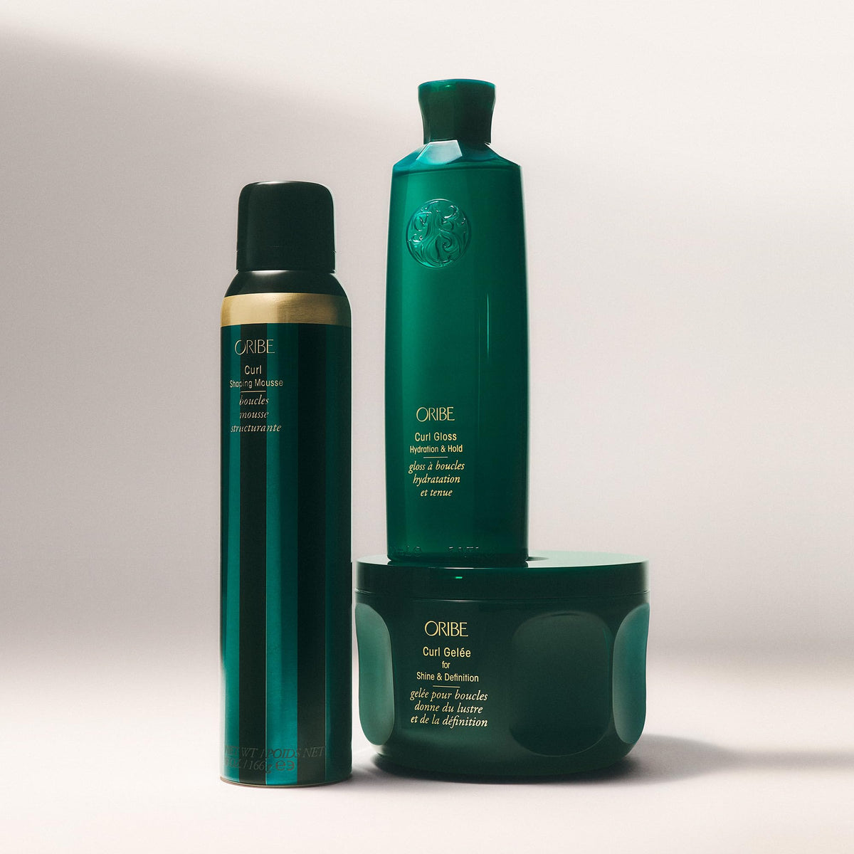 Oribe Curl Gloss label close-up highlighting ingredients and conditioning benefits