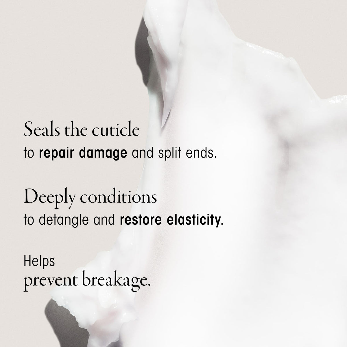 ORIBE being applied to wet curls demonstrating improved detangling benefit