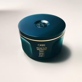 ORIBE label close-up showing product name and clear usage benefit