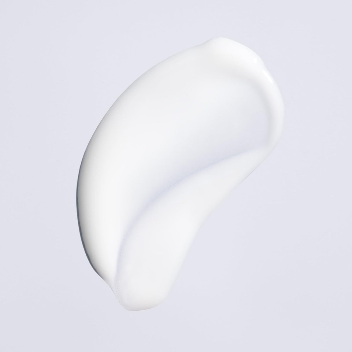 Oribe Featherbalm applied to hair demonstrating smoothing and shine benefit