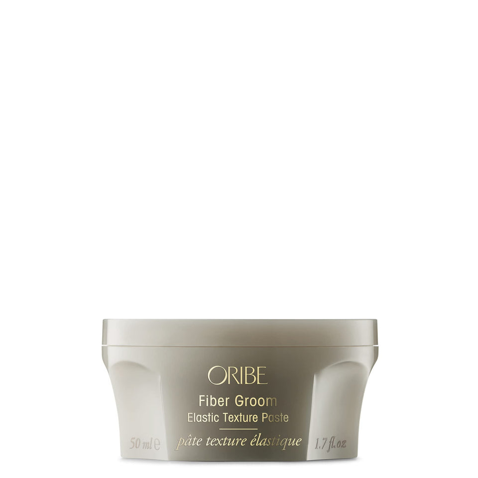 Oribe Fiber Groom front packaging shows brand and compact styling jar, professional appeal
