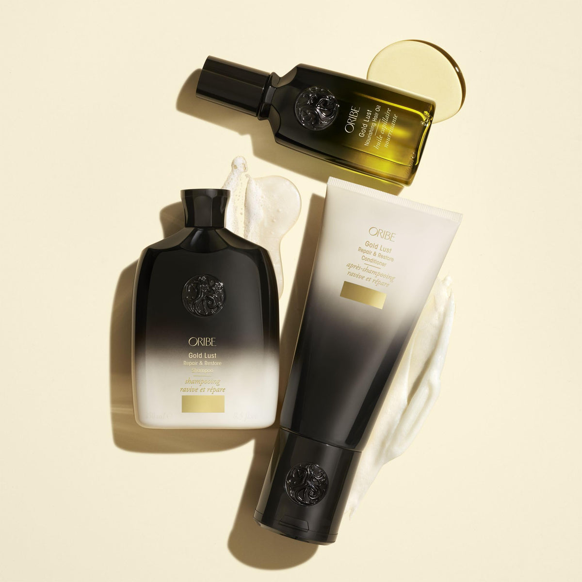 Lifestyle bathroom scene with Oribe Gold Lust oil on shelf for everyday luxury