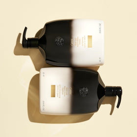 Oribe Gold Lust next to common objects showing 33.8oz size for value benefit