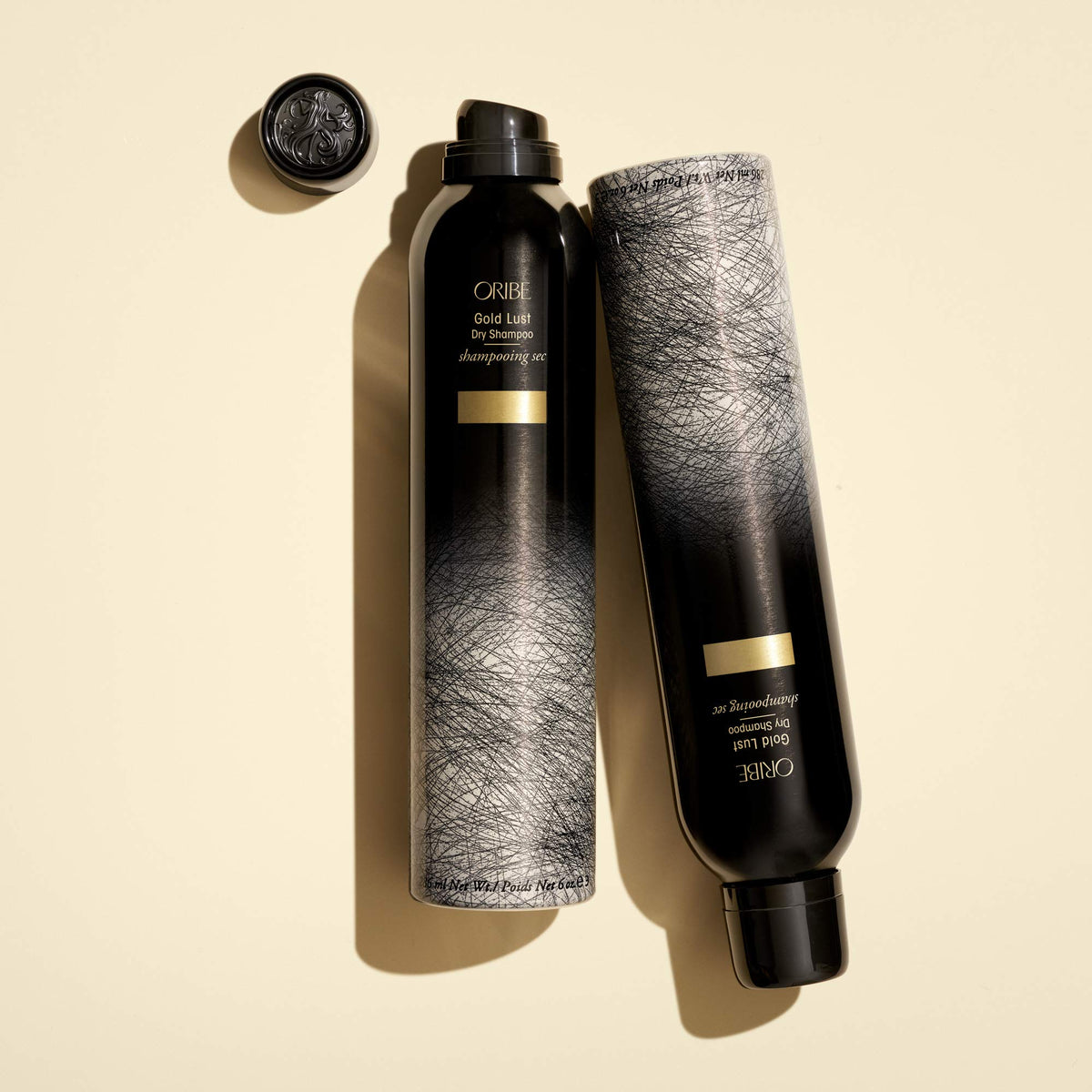 Oribe Gold Lust dry shampoo on bathroom vanity styled for refreshed, salon-fresh hair