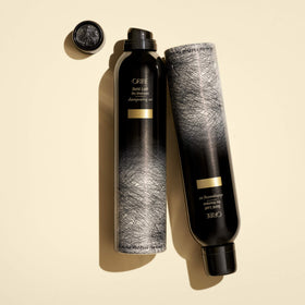 Oribe Gold Lust dry shampoo on bathroom vanity styled for refreshed, salon-fresh hair