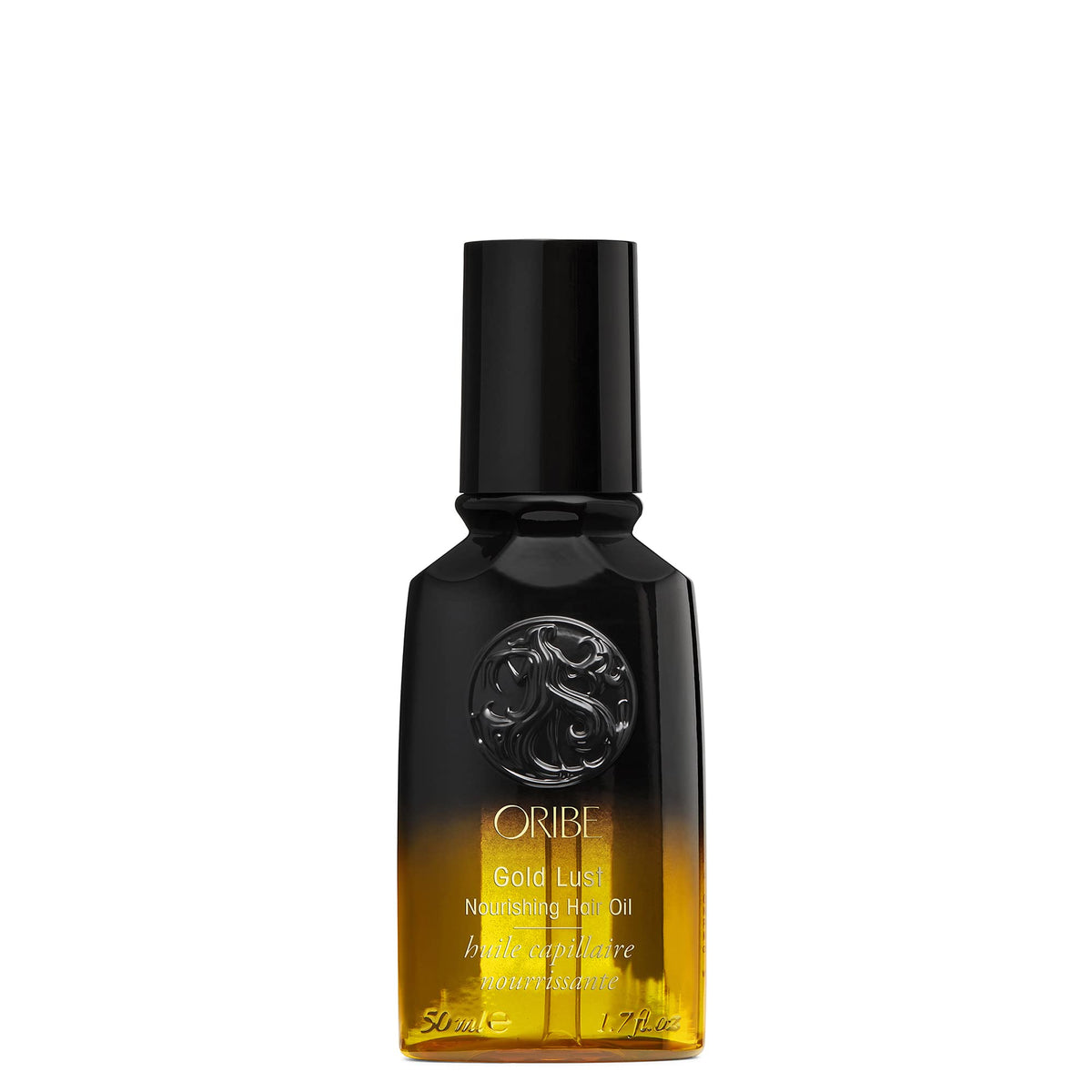 Oribe Gold Lust front bottle on white surface showing luxury packaging and shine
