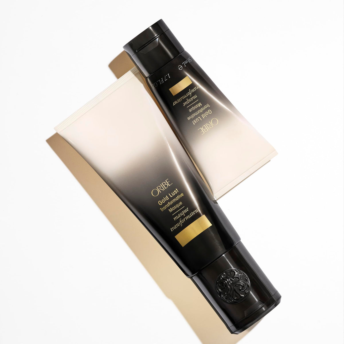 Oribe Gold Lust packaging staged in a bathroom setting exuding salon luxury