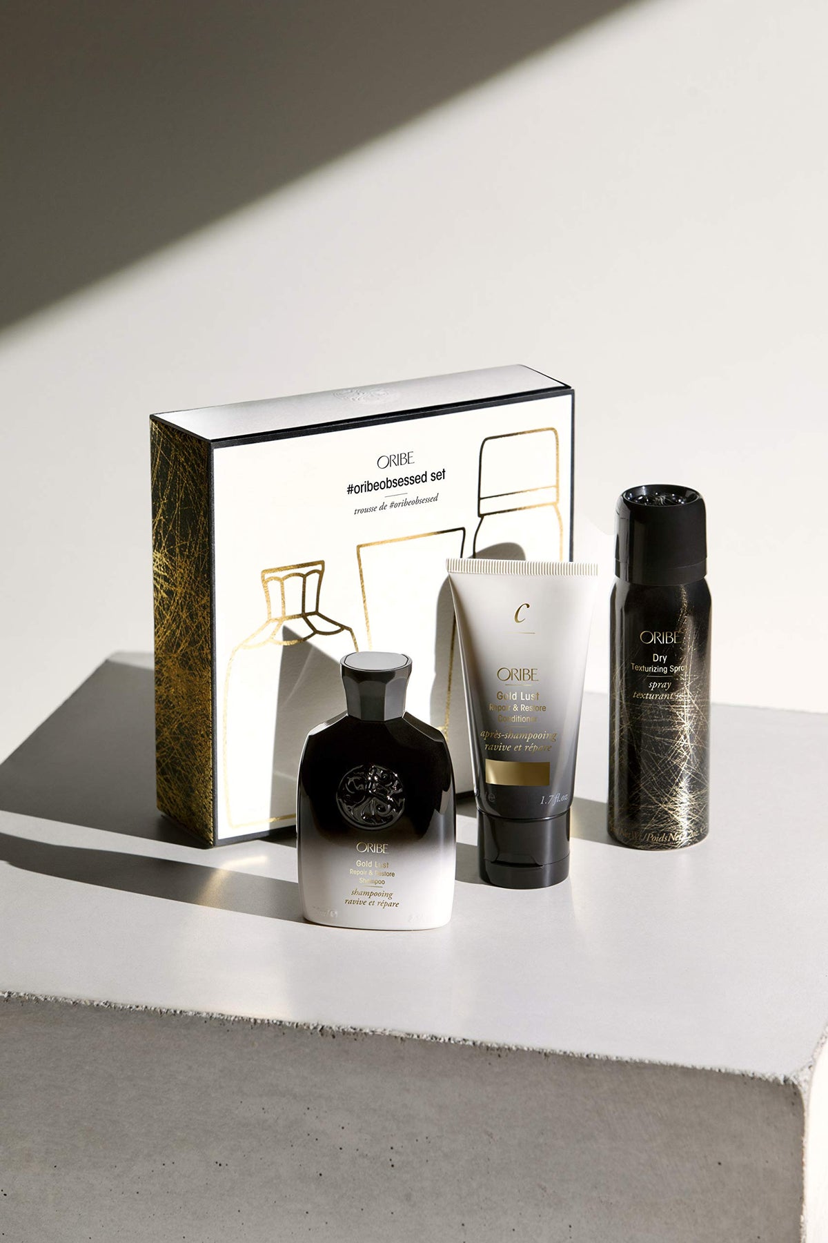 Oribe Gold Lust shampoo bottle close-up highlighting pump and nourishing benefits