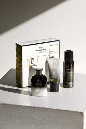 Oribe Gold Lust shampoo bottle close-up highlighting pump and nourishing benefits