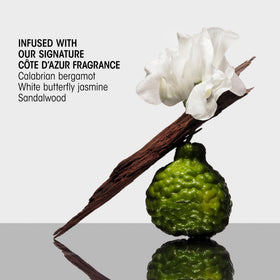 Finished shiny smooth hair after Oribe Gold Lust showing frizz reduction