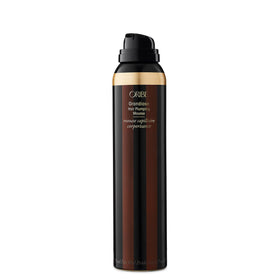 Close-up of Oribe Grandiose mousse texture dispensing, showing airy foam and hydration