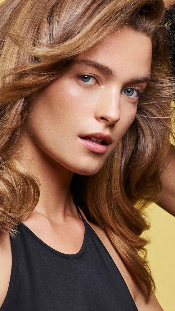 Oribe texture of the shampoo on hands illustrating smooth consistency and easy spreadability