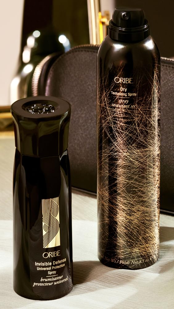 Oribe Invisible Defense being applied to hair outdoors to reduce frizz and damage