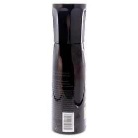 Oribe spray mist in use on hair demonstrating lightweight protection and frizz control