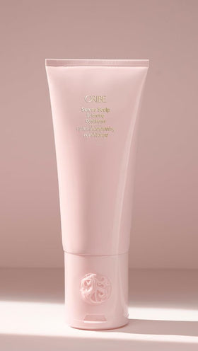 ORIBE bottle on bathroom shelf in styled setting suggesting premium self-care