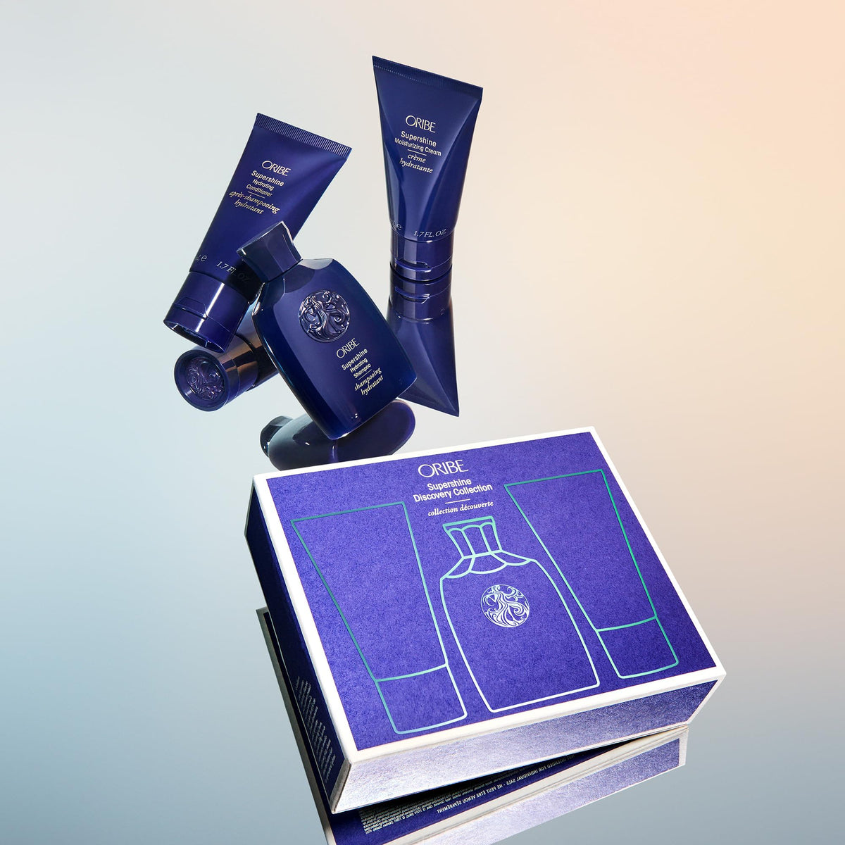 Oribe lifestyle image of glossy hair at beach showcasing luminous shine benefit
