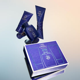 Oribe lifestyle image of glossy hair at beach showcasing luminous shine benefit